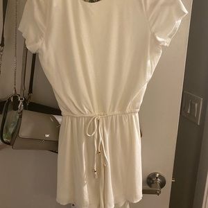 brand new, white romper. total backless. tags on!